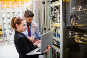 Man and woman assessing a company's cable network