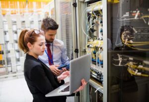 Man and woman assessing a company's cable network