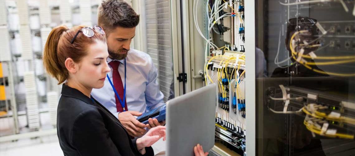 Man and woman assessing a company's cable network