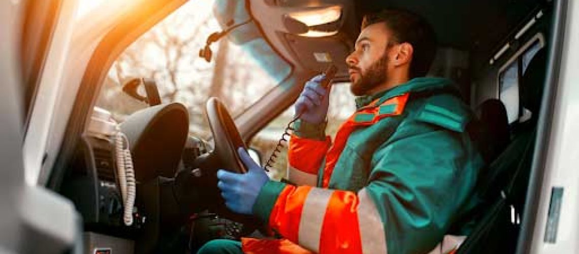 Emergency responder talking into an intercom